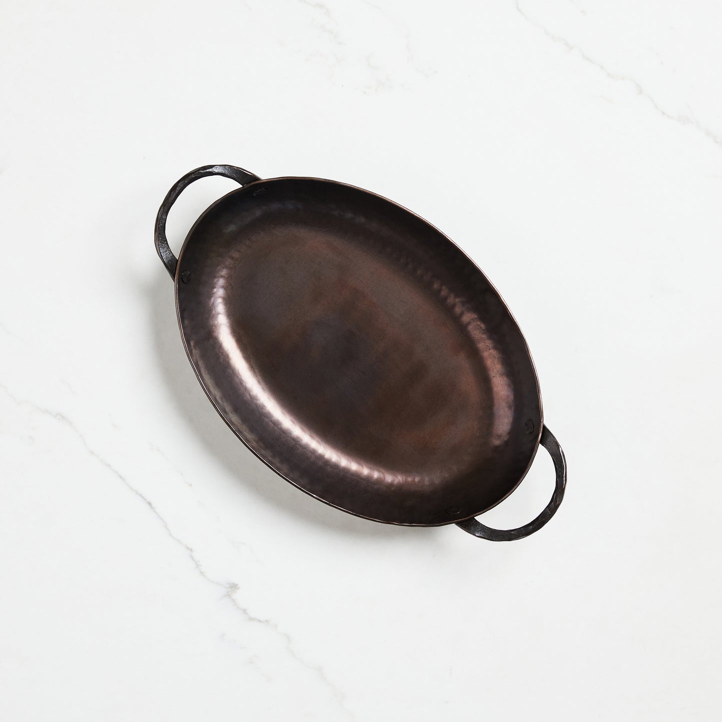 Oval lightweight carbon steel roasting pan hand-hammered