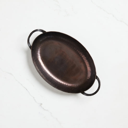 Oval lightweight carbon steel roasting pan hand-hammered