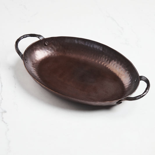 Oval lightweight carbon steel roasting pan hand-hammered