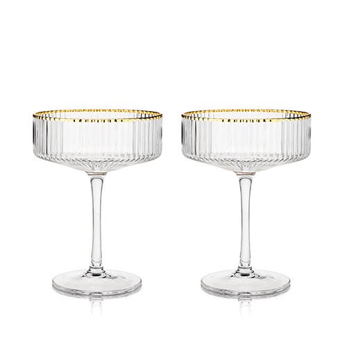 This set of coupe glasses is clear, with gold rims.