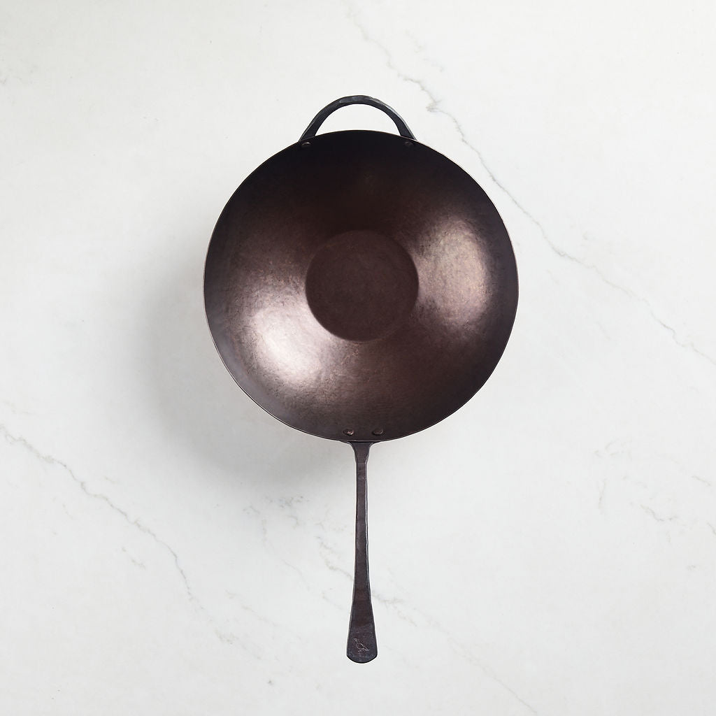 Each carbon steel wok comes with a smooth, pre-seasoned interior.