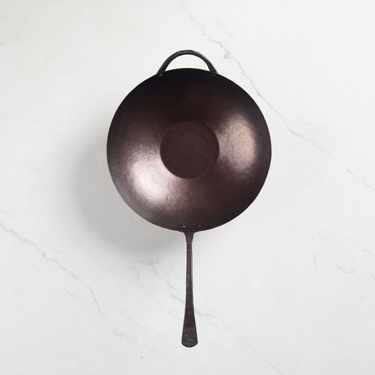Each carbon steel wok comes with a smooth, pre-seasoned interior.
