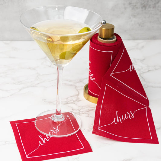 Buy one (1) set of red cocktail napkins, on a roll, with a gold stand.
