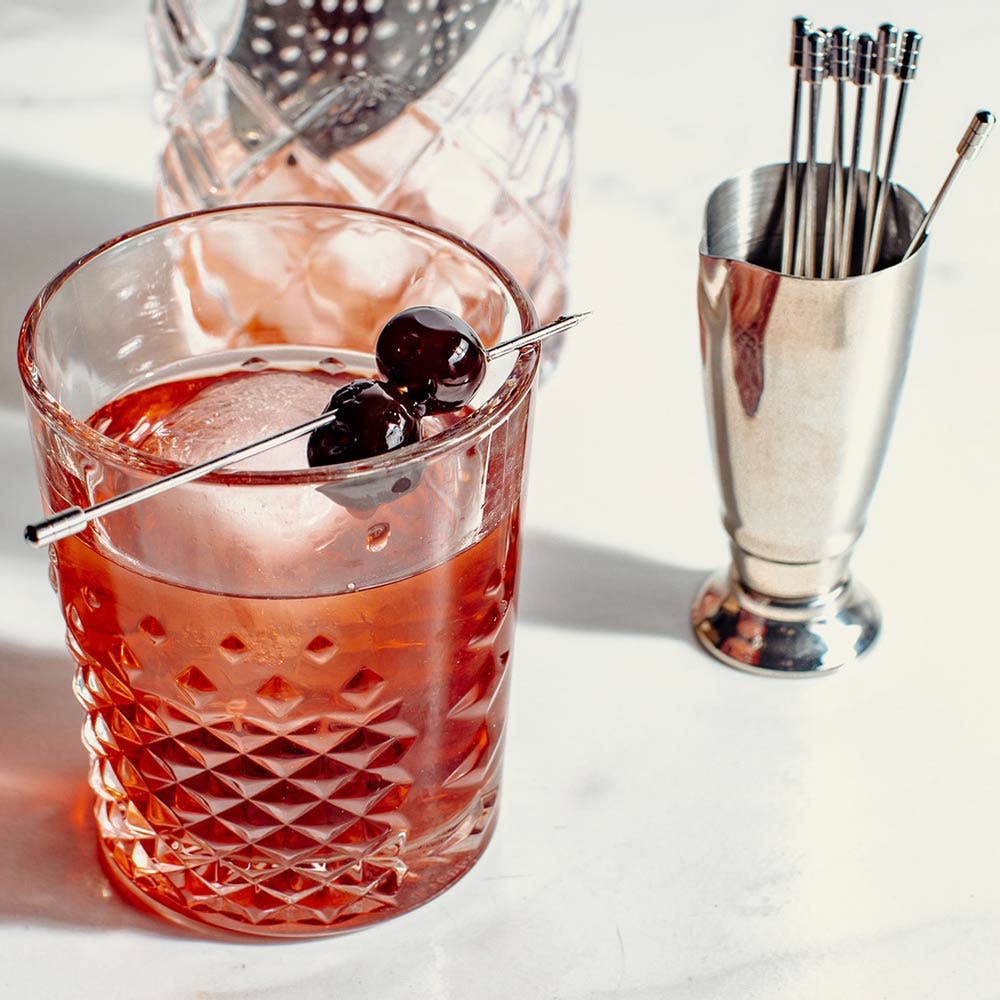 This footed 2 oz jigger has a convenient pour spout and is dishwasher-safe.