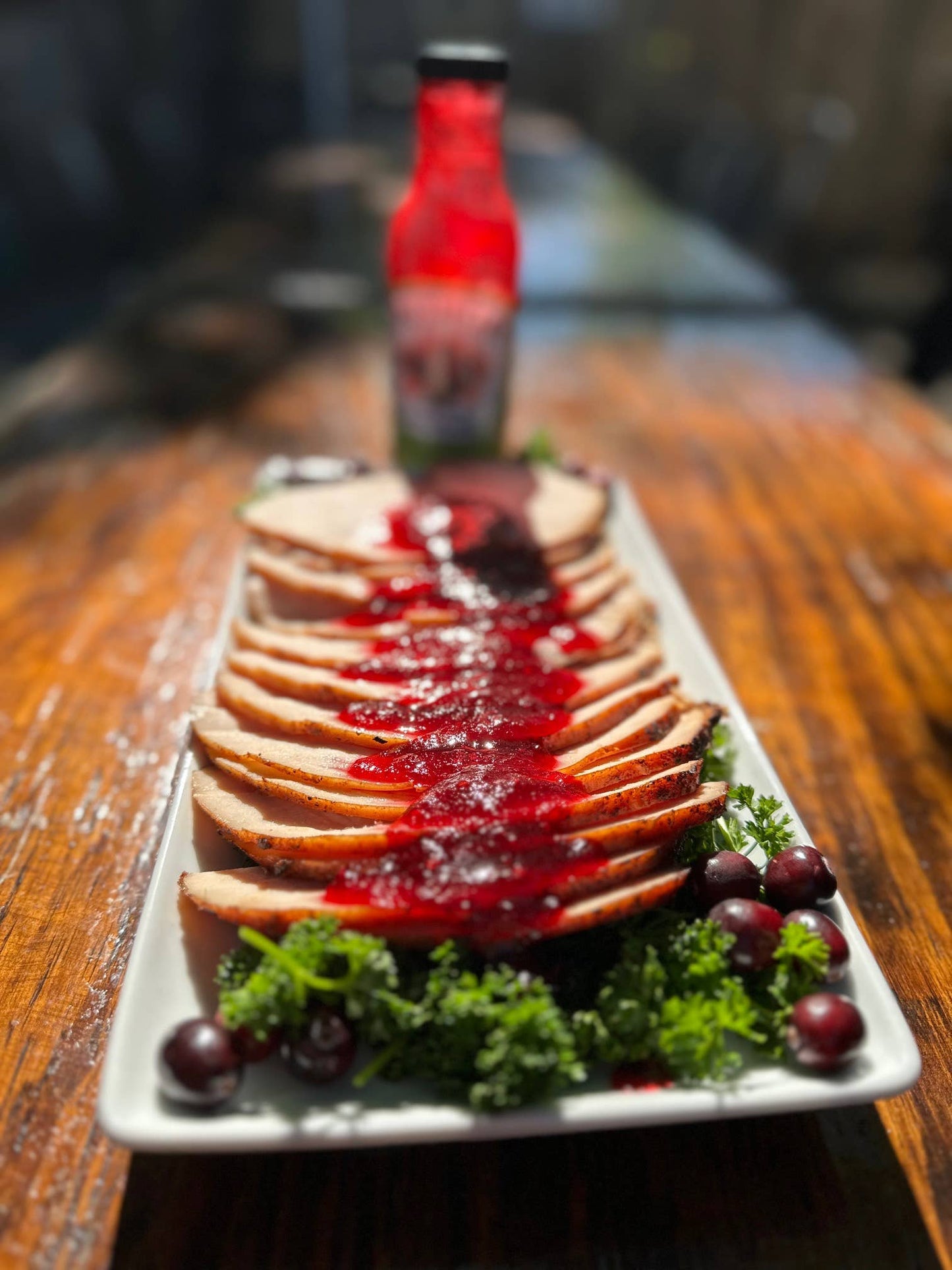 Buy 1 (one) bottle of cranberry pepper sauce to serve on top of smoked turkey.