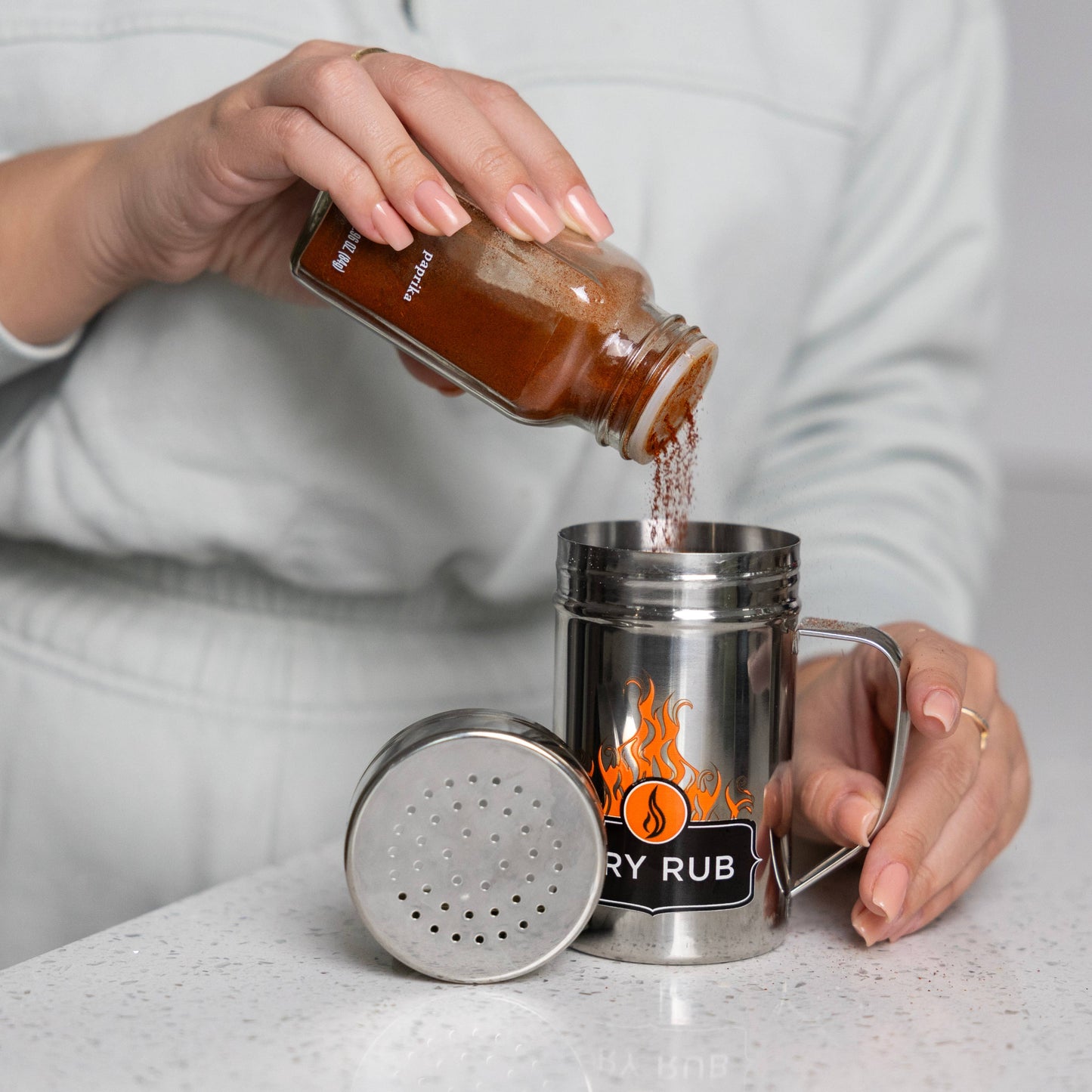 Fill the dry rub shaker with your own blend, or with store-bought variety. It holds more product and applies it more evenly.