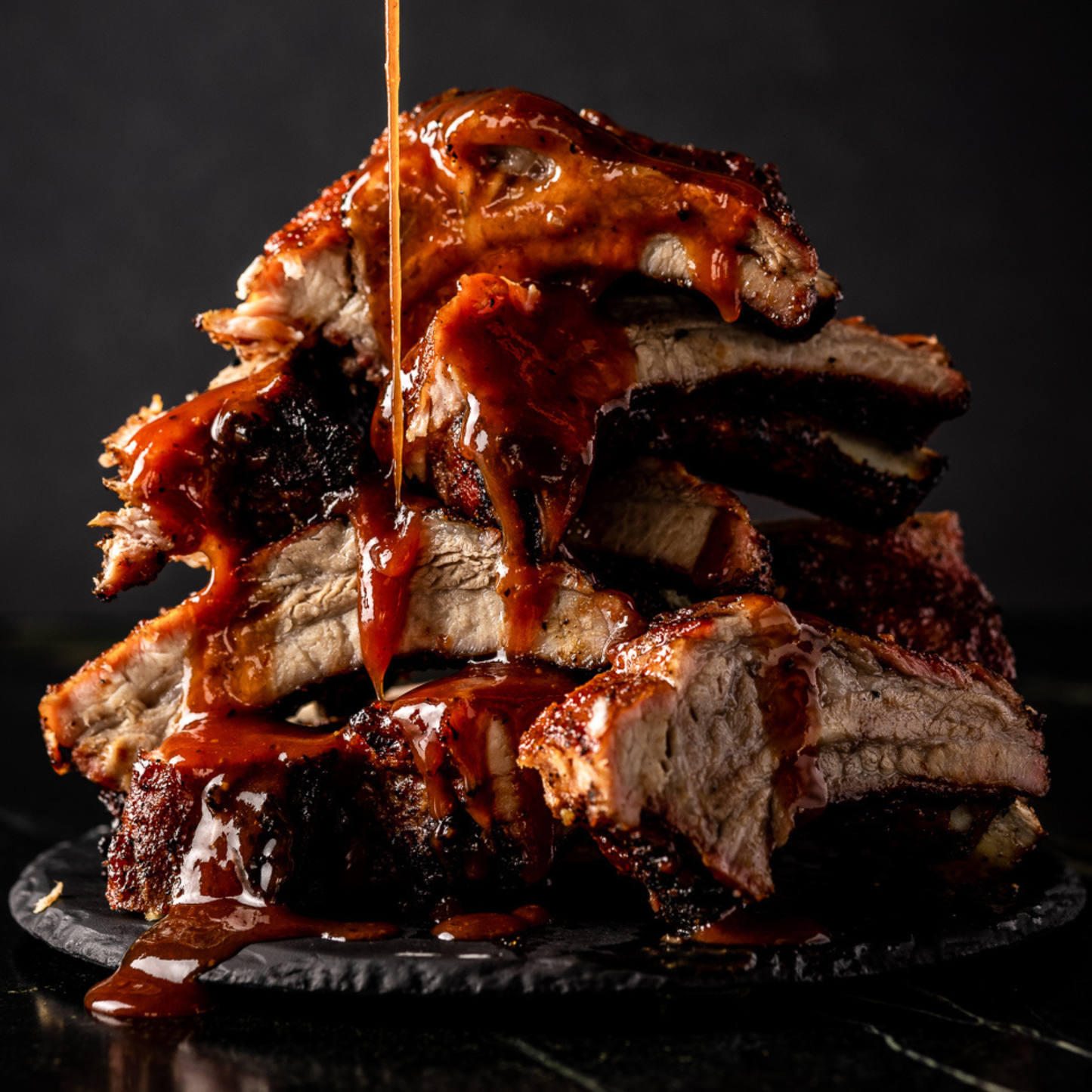 Everything BBQ Sauce is delicious slathered on smoked pork ribs.