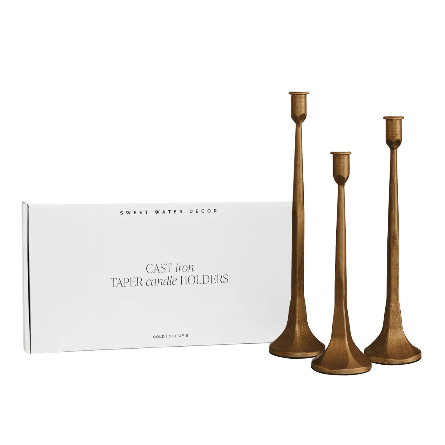 Buy this set of three gold cast iron taper candle holders, which come in a sleek, modern box for gift-giving.