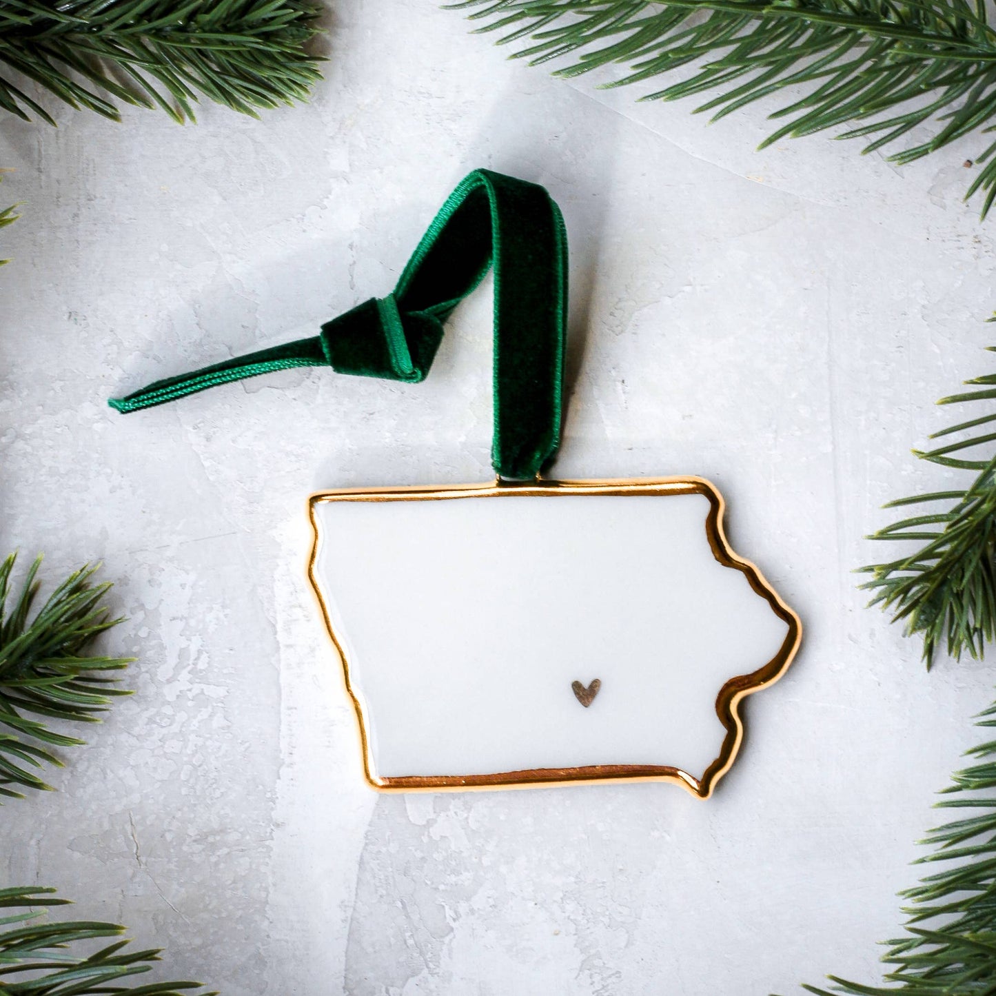 Buy 1 (one) Iowa-shaped porcelain Christmas ornament.