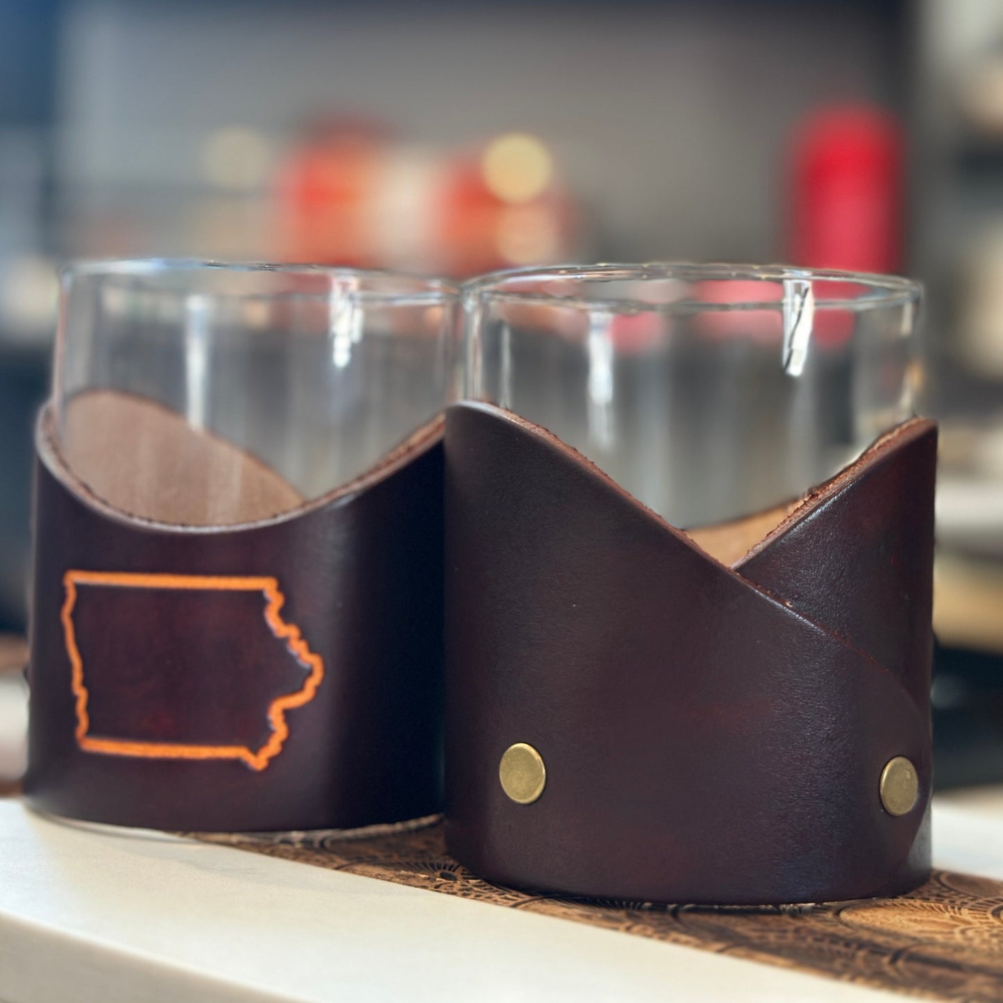 Two glasses (each sold separately) are pictured here, one showing the craftsmanship on the backside.