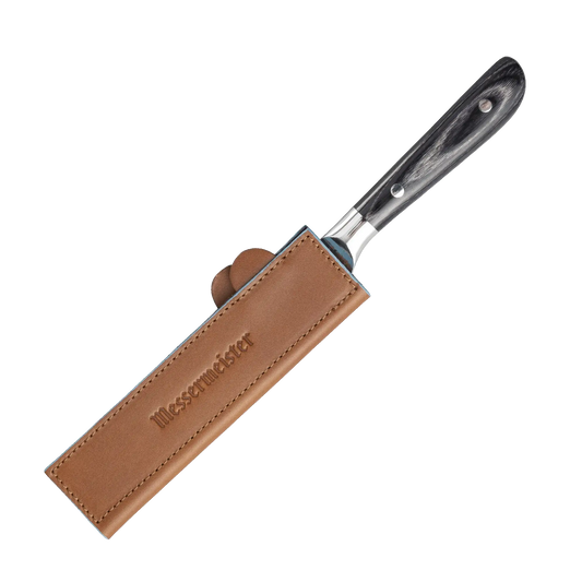The leather knife cover magnetically closes to protect your blade.