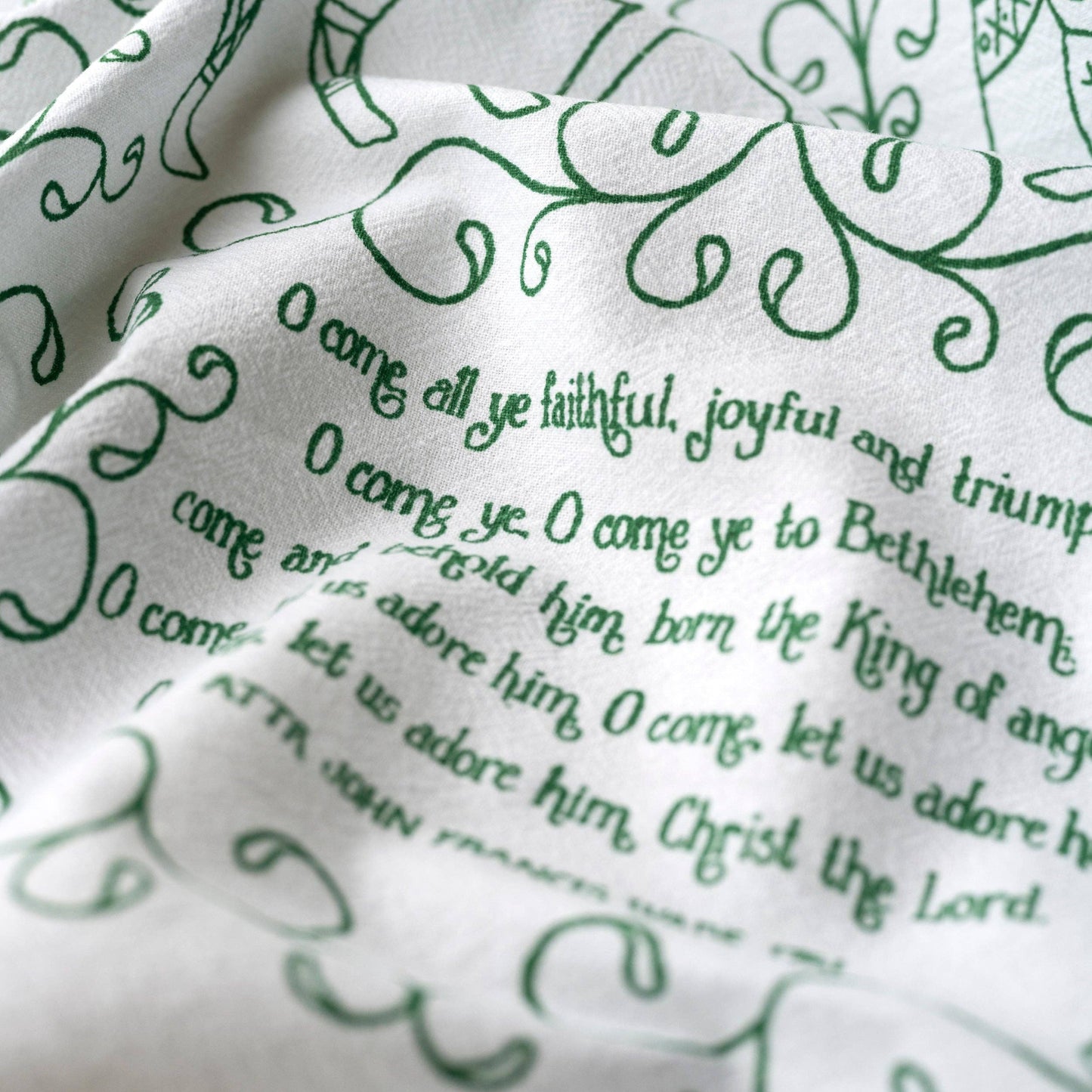 Beautiful evergreen text against a white cotton towel.