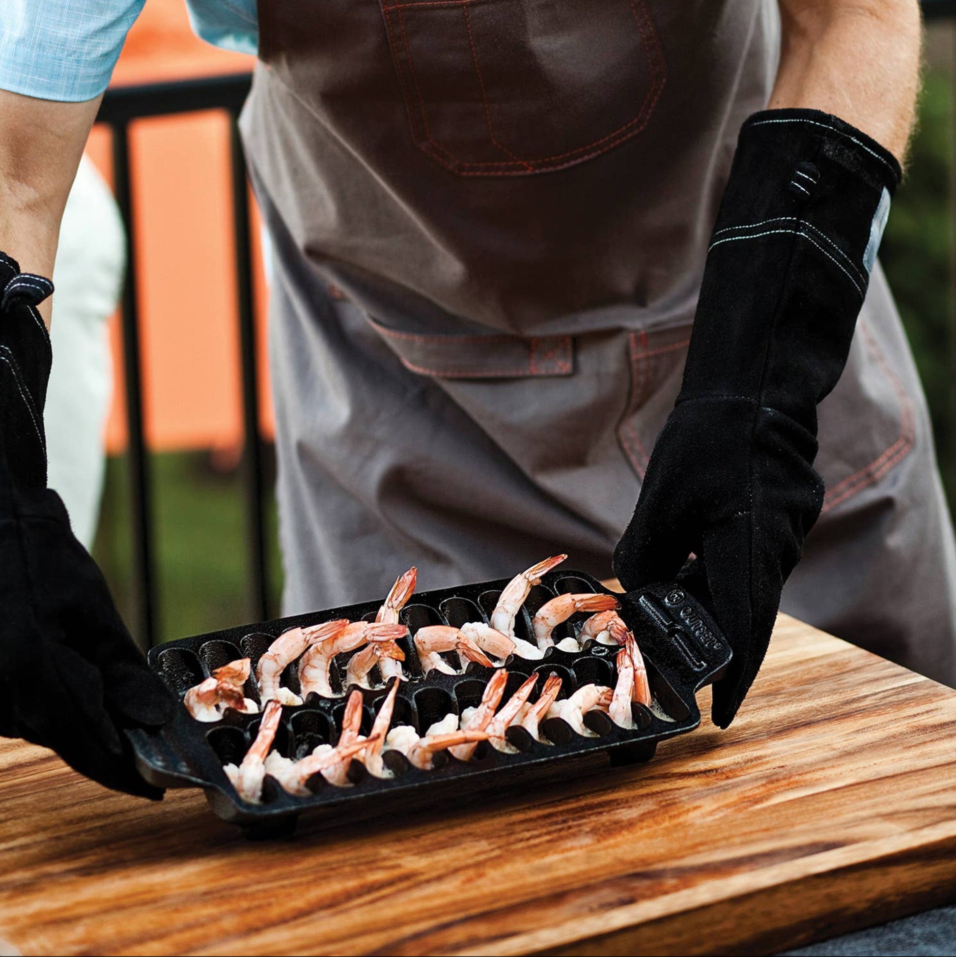 Place shrimp in each of the slots and place the pan on the grill for perfectly cooked shellfish.