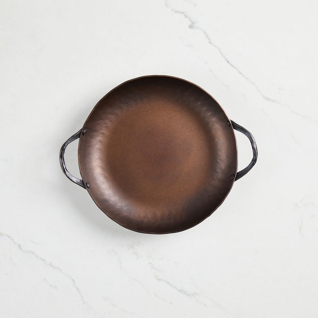 This lightweight round roaster is hand forged in Charleston, S.C.