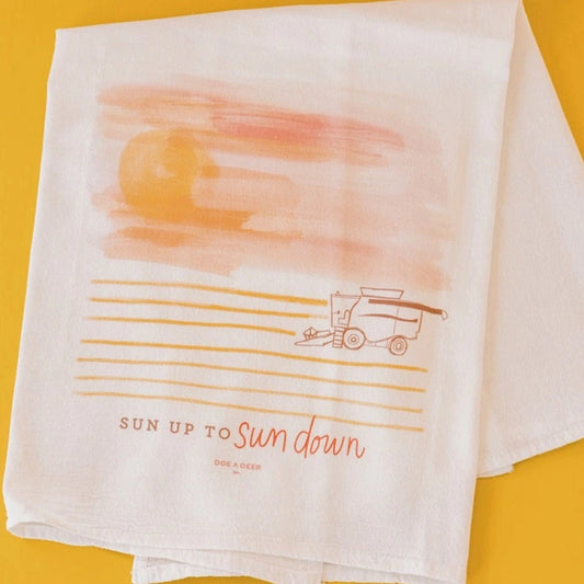 The beautiful artwork on this Sun Up to Sun Down towel is shades of pink, orange and brown.