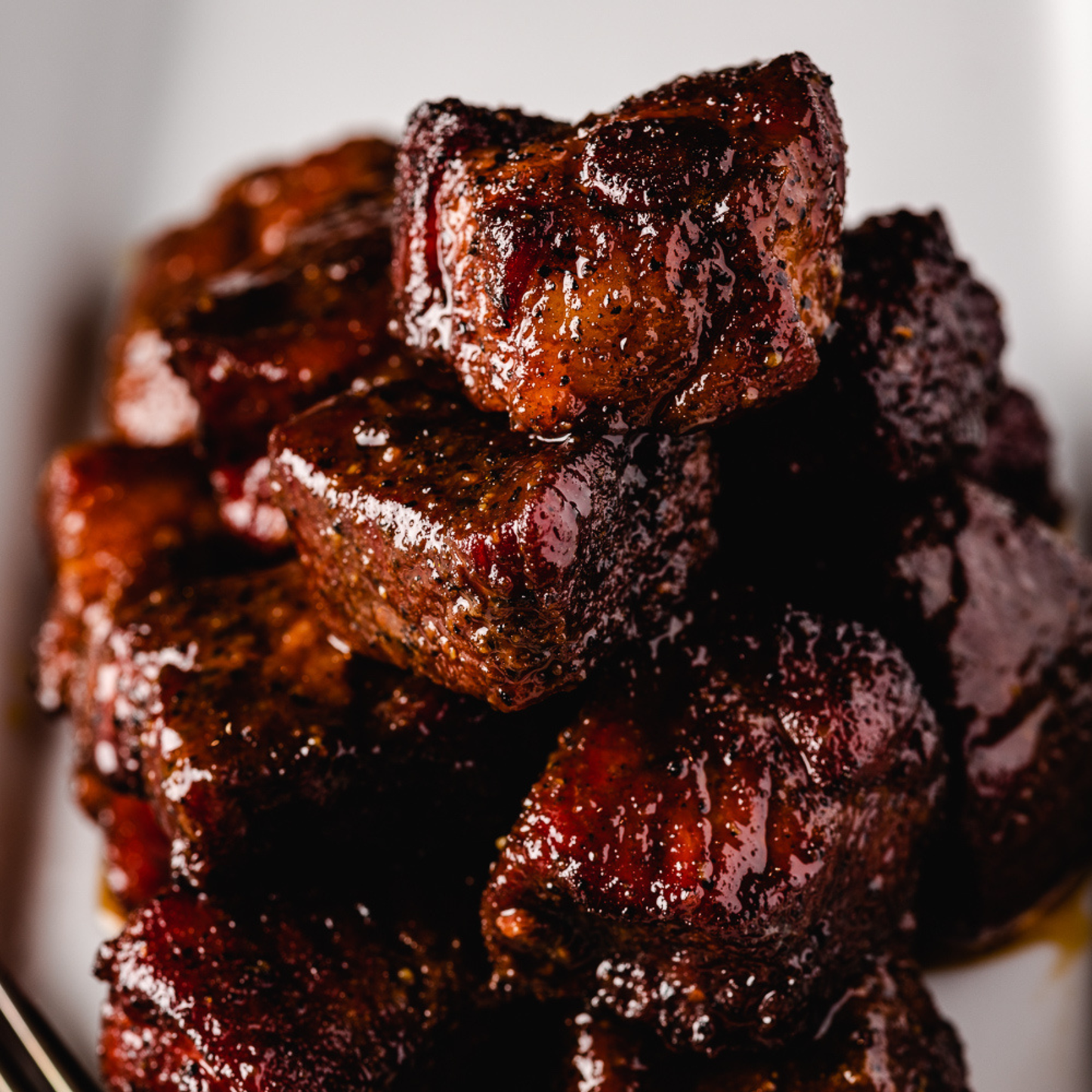 Whiskey Peach BBQ Sauce is great on pork belly burnt ends.