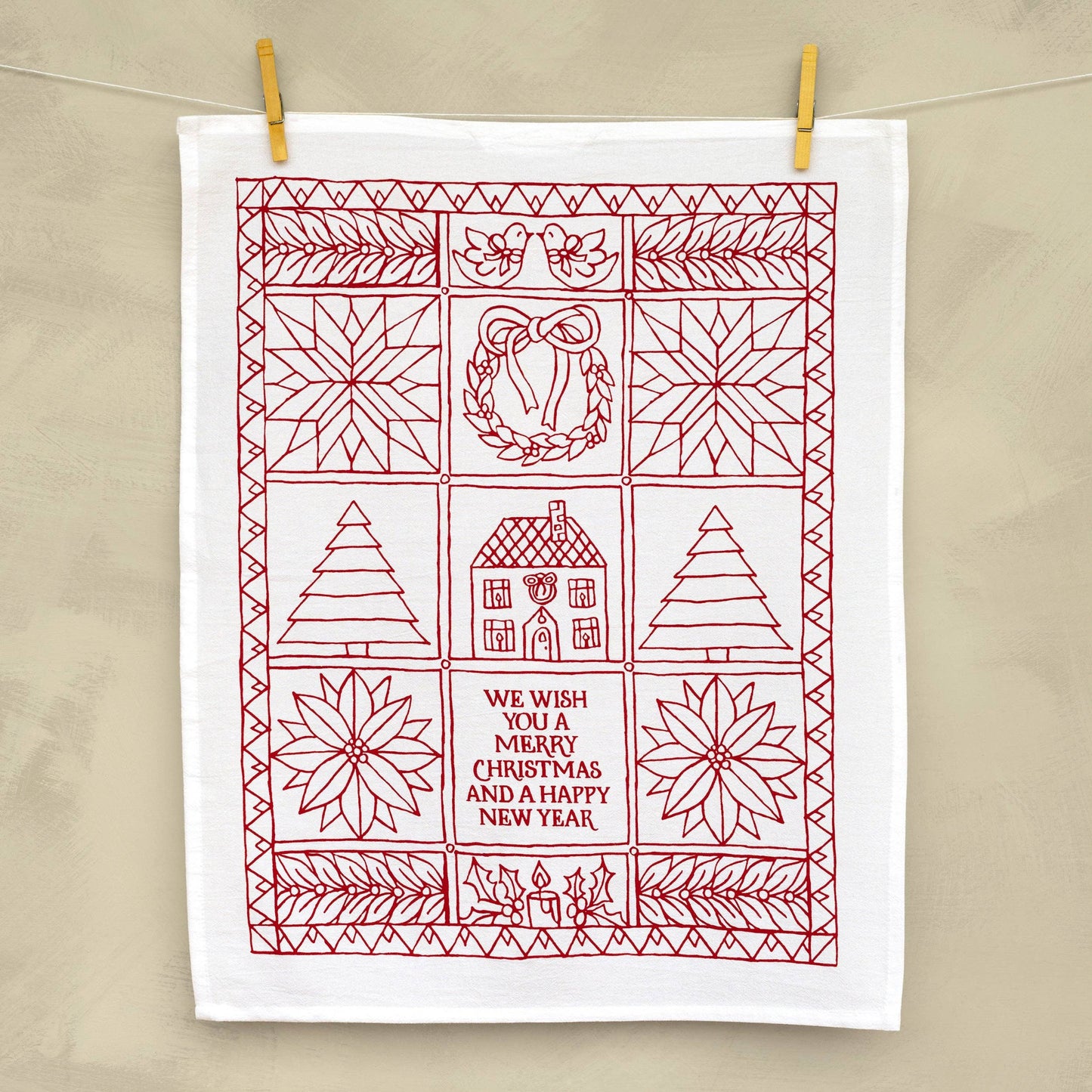 Smile every time you pass by this festive holiday tea towel in your kitchen.
