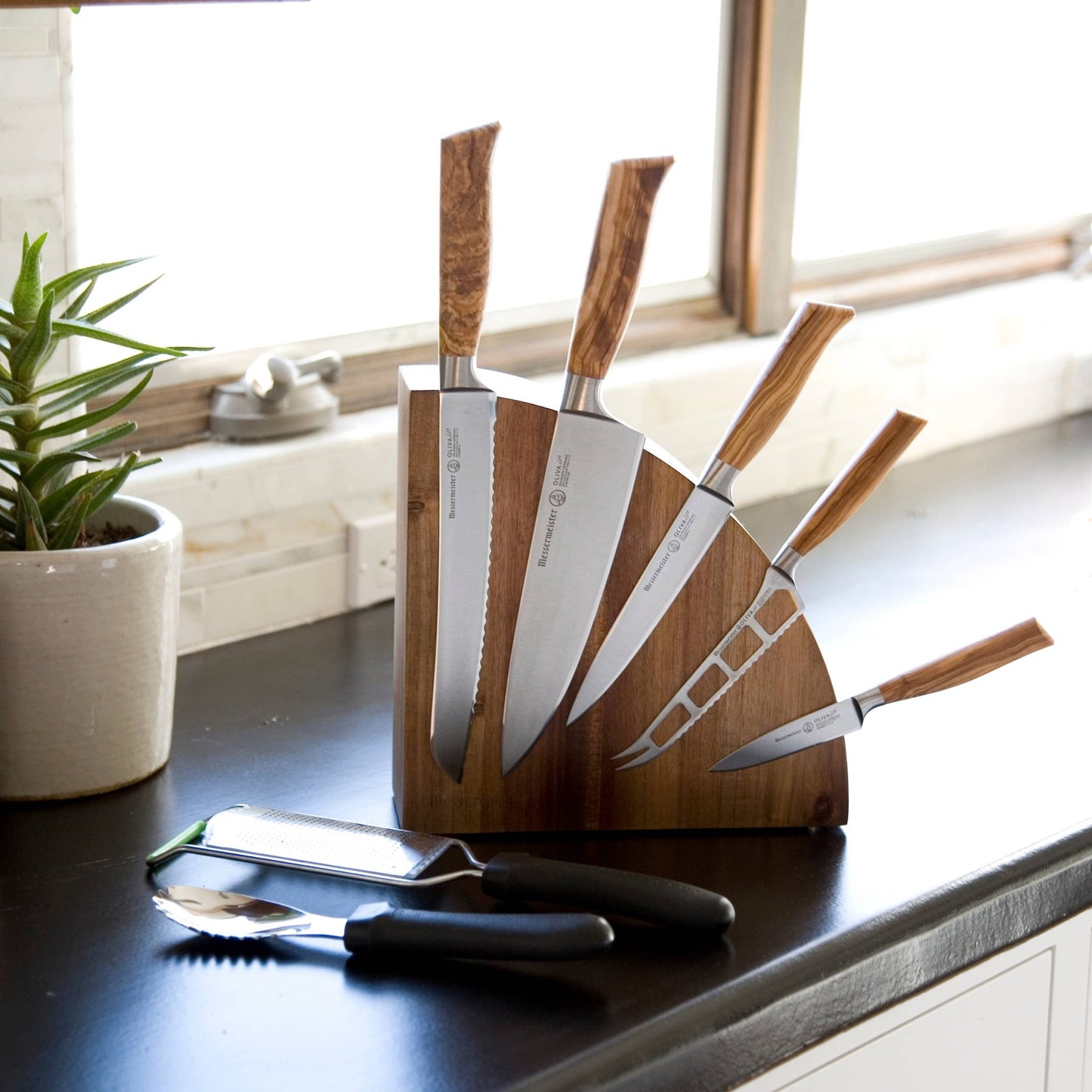 This knife holder can hold up to 10 blades, 5 on each side.