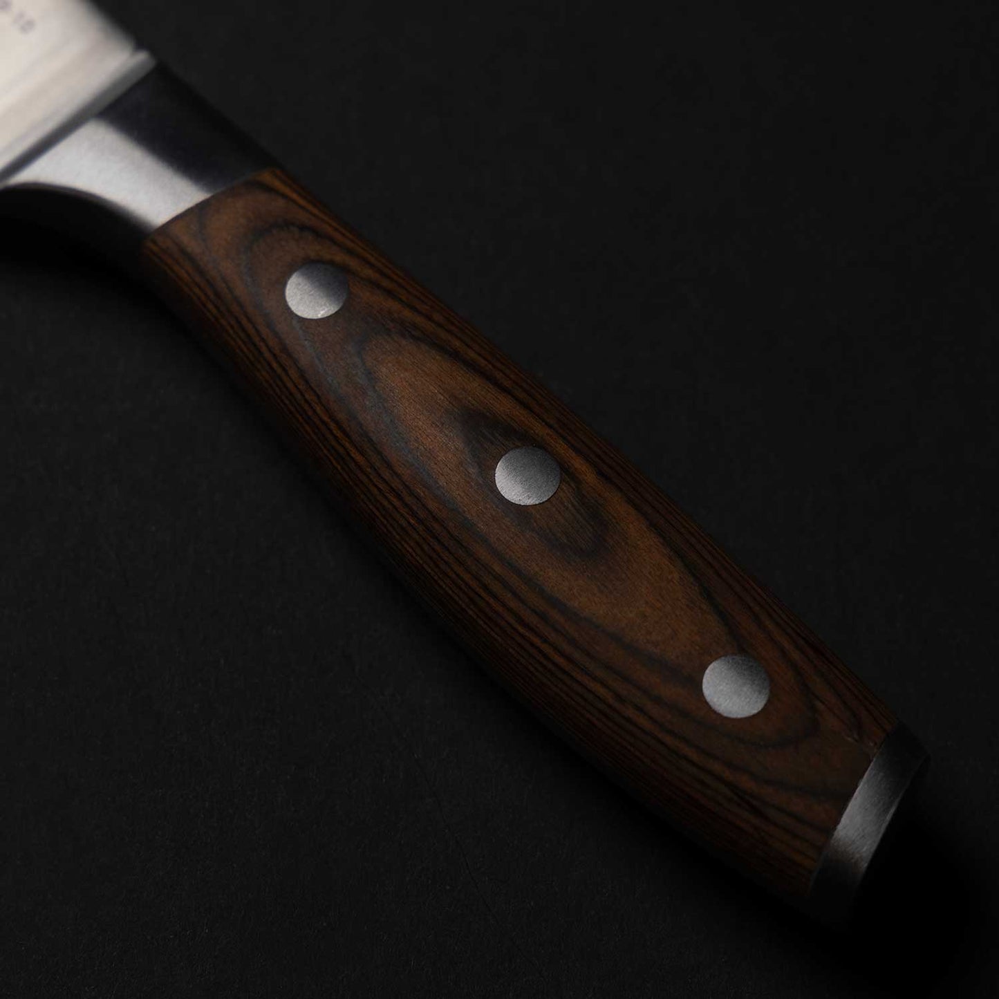 Pakkawood handle with triple rivet.