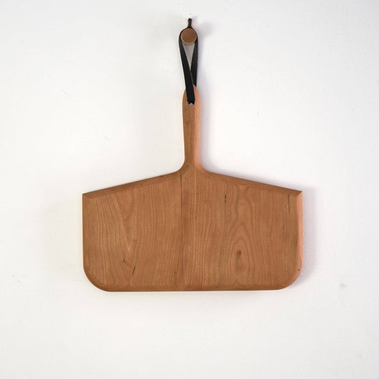 Buy one (1) whale bone cutting board carved from cherry wood.