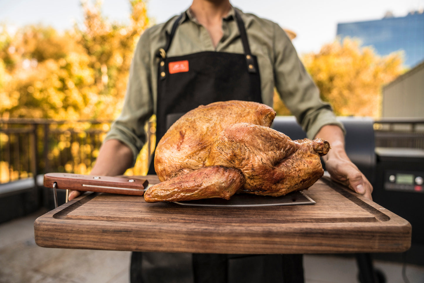 A home chef shows off his smoked turkey made with Traeger's brine and rub kit.