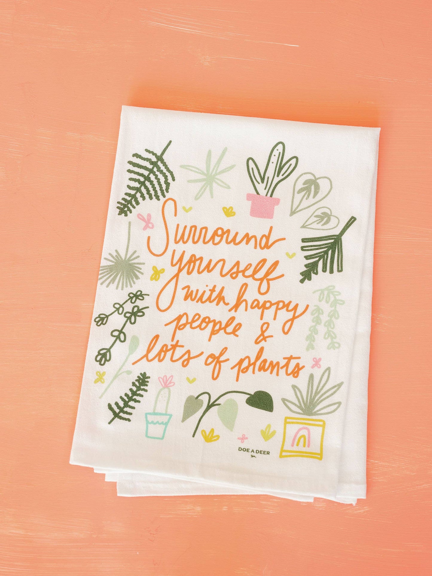 Buy one (1) machine-washable flour sack towel with a plant-themed happy message.