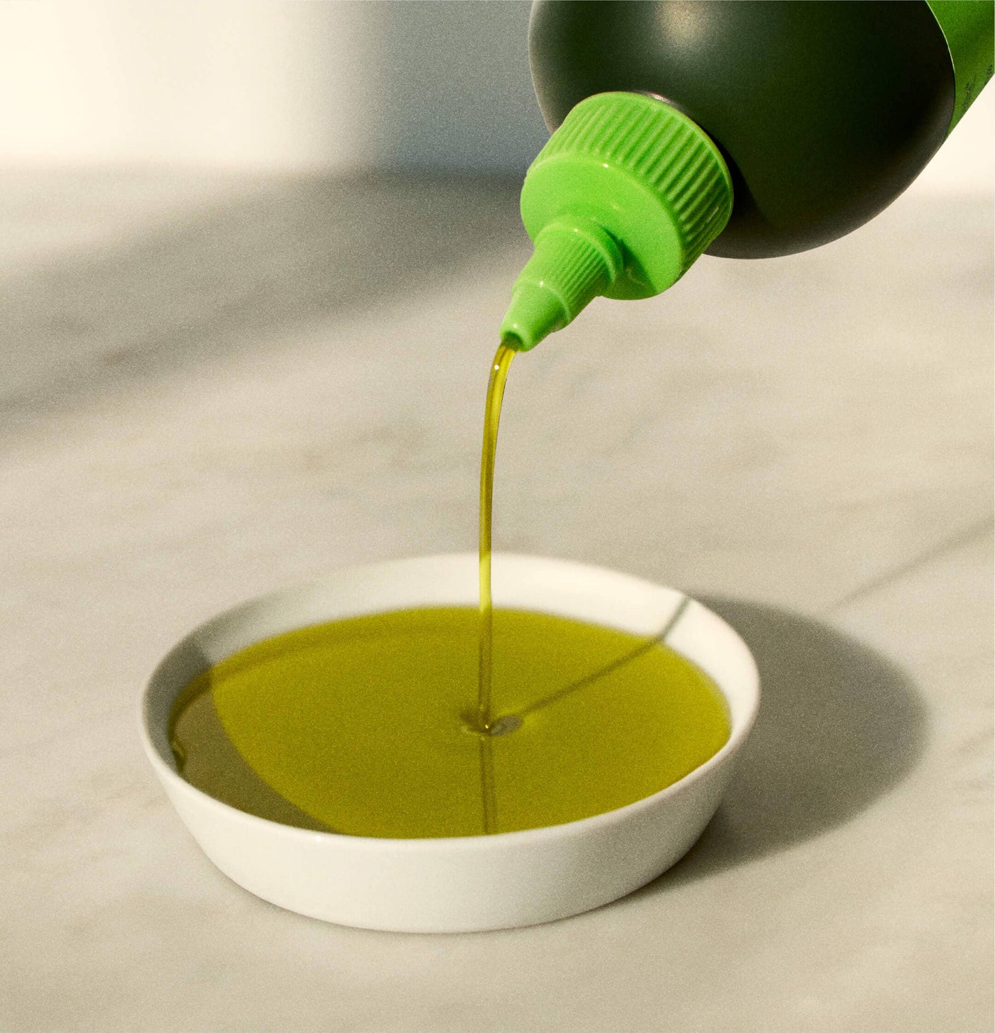 Drizzle extra virgin olive oil is a beautiful green color. 