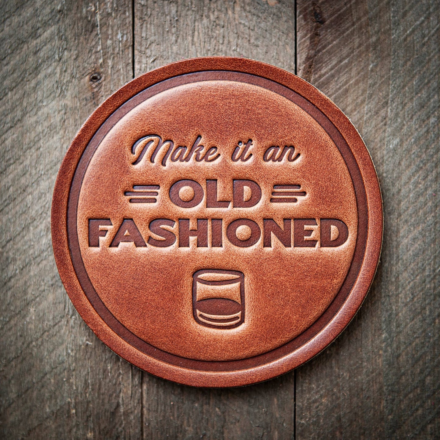 Buy this (1)  leather coaster stamped with a design that says, "Make it an Old Fashioned."