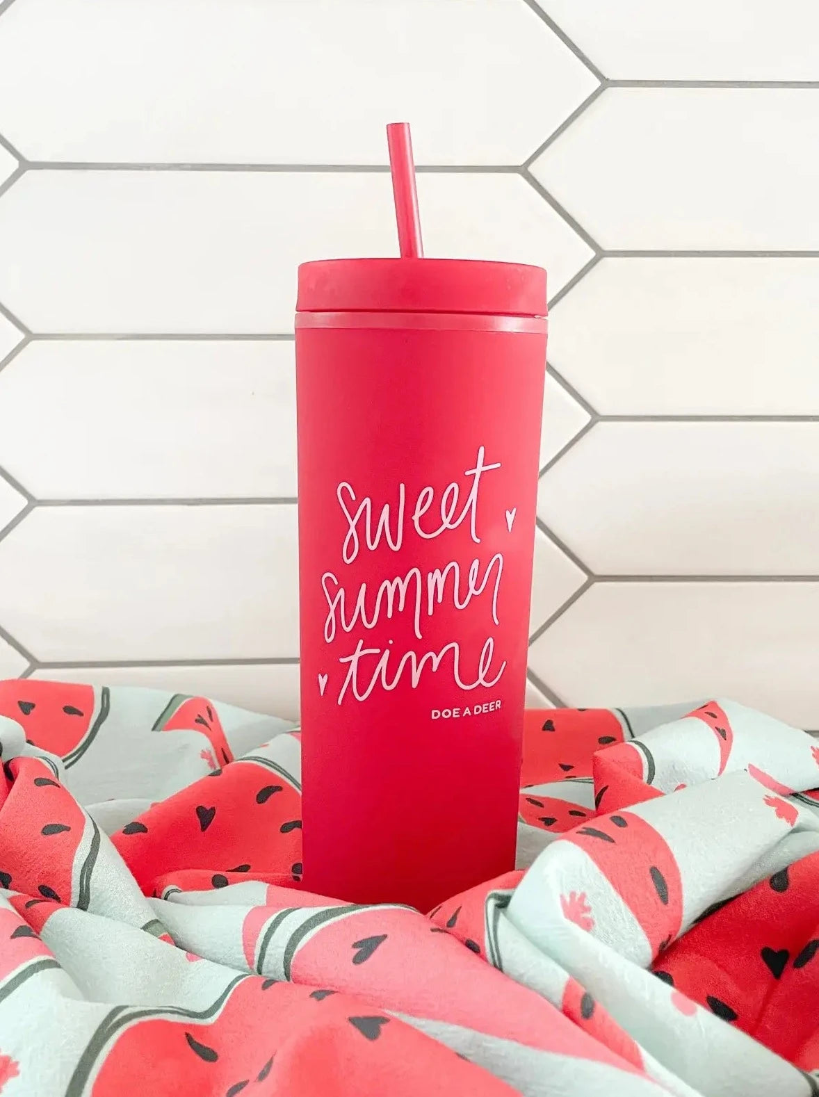 The "sweet summer time" tumbler is the same color as the inside of a ripe watermelon.