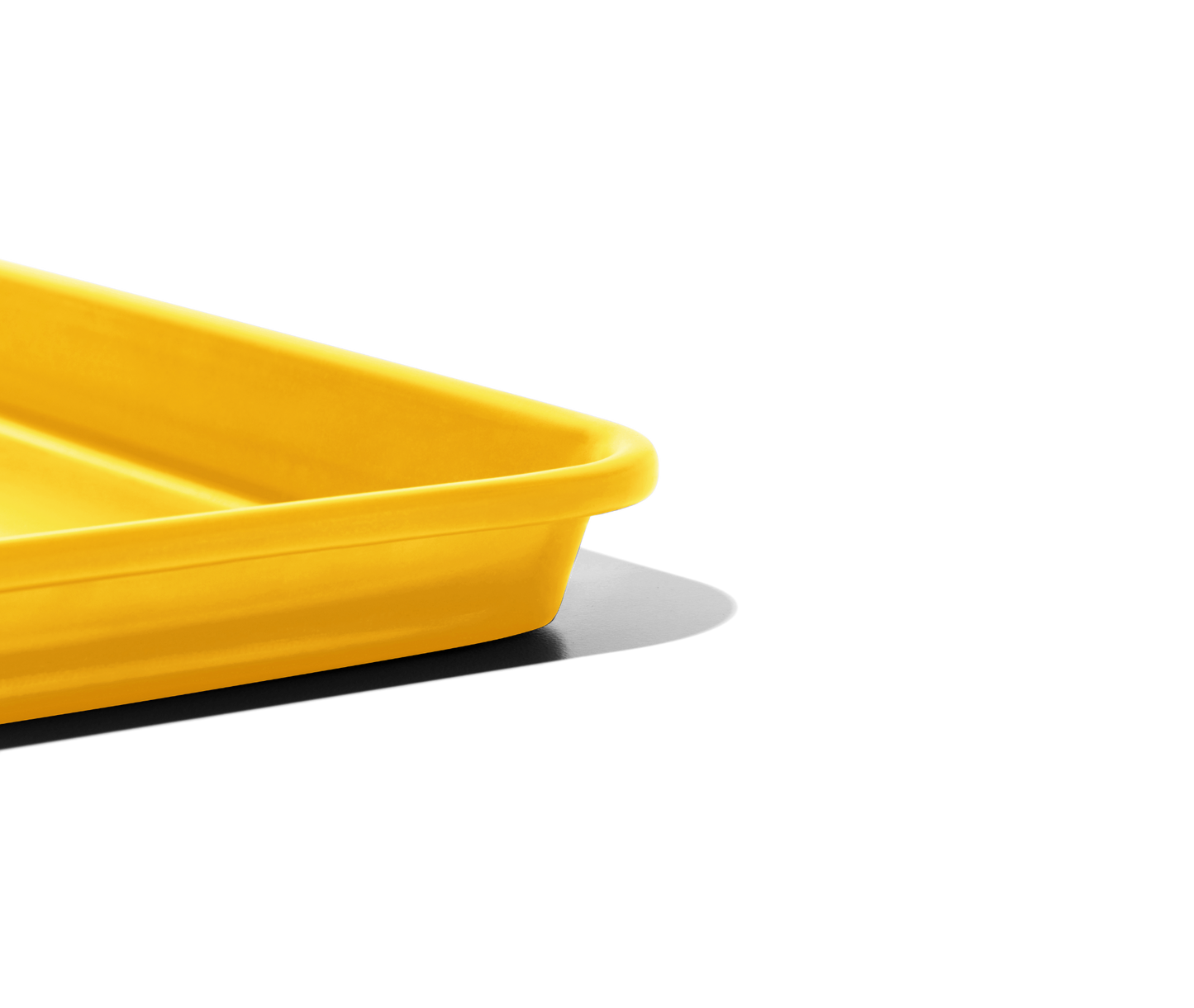 Holy Sheet pan in mustard yellow is a rimmed half-sheet, the perfect size for home kitchens.