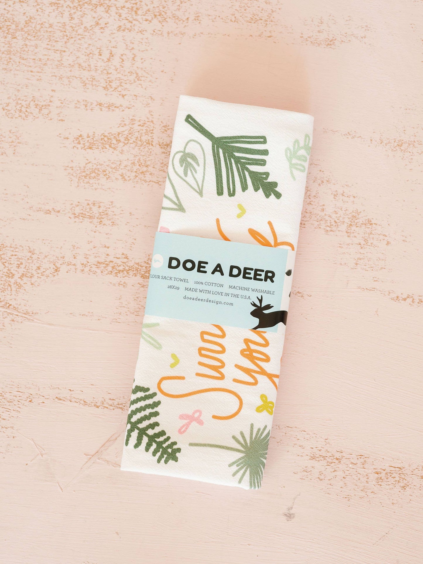 Plant lover's flour sack towel is beautiful and packaged for gifting.