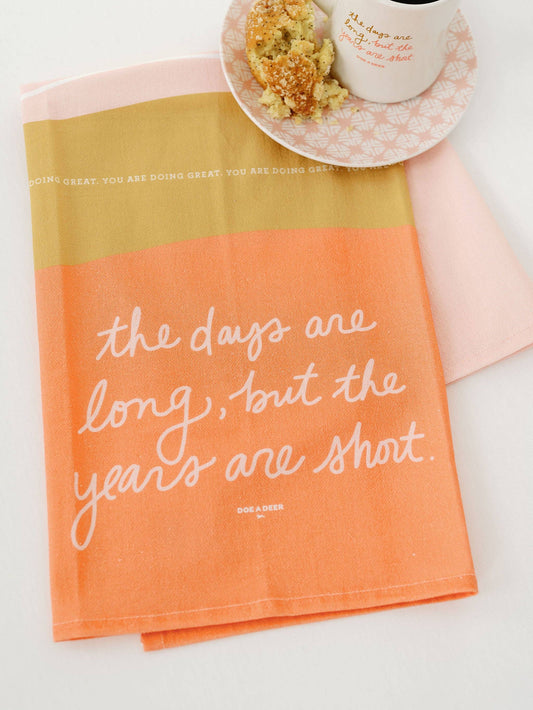 Buy one (1) tea towel gift for Mom that says, "the days are long, but the years are short."