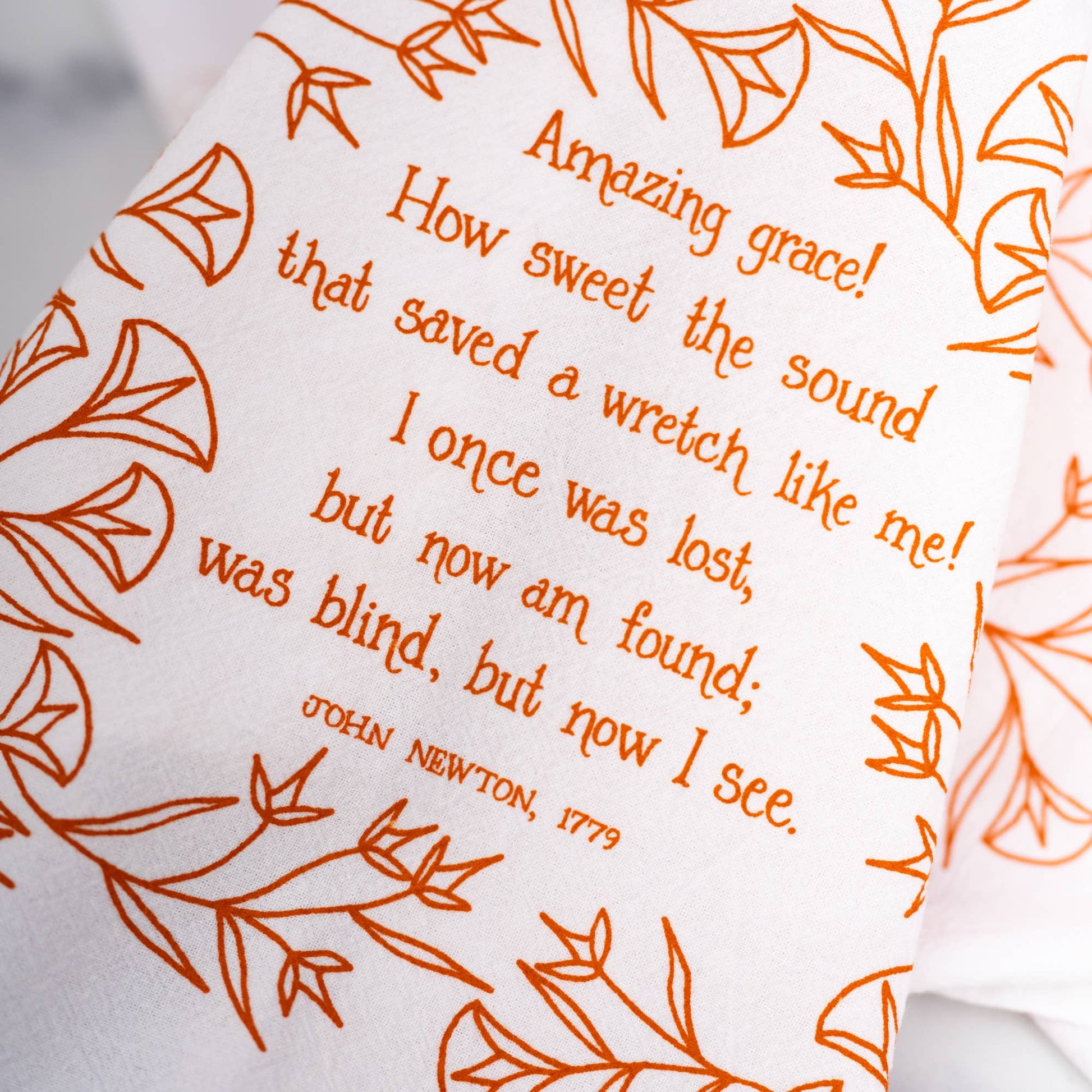 Buy 1 (one) Amazing Grace tea towel with hymn lyrics in a warm marmalade color.