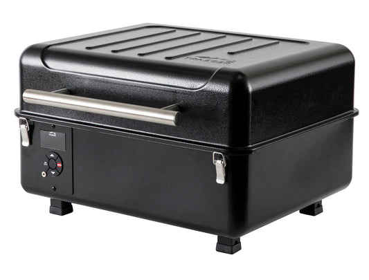 The portable pellet grill is black with a digital controller and stainless steel handle and clasps.