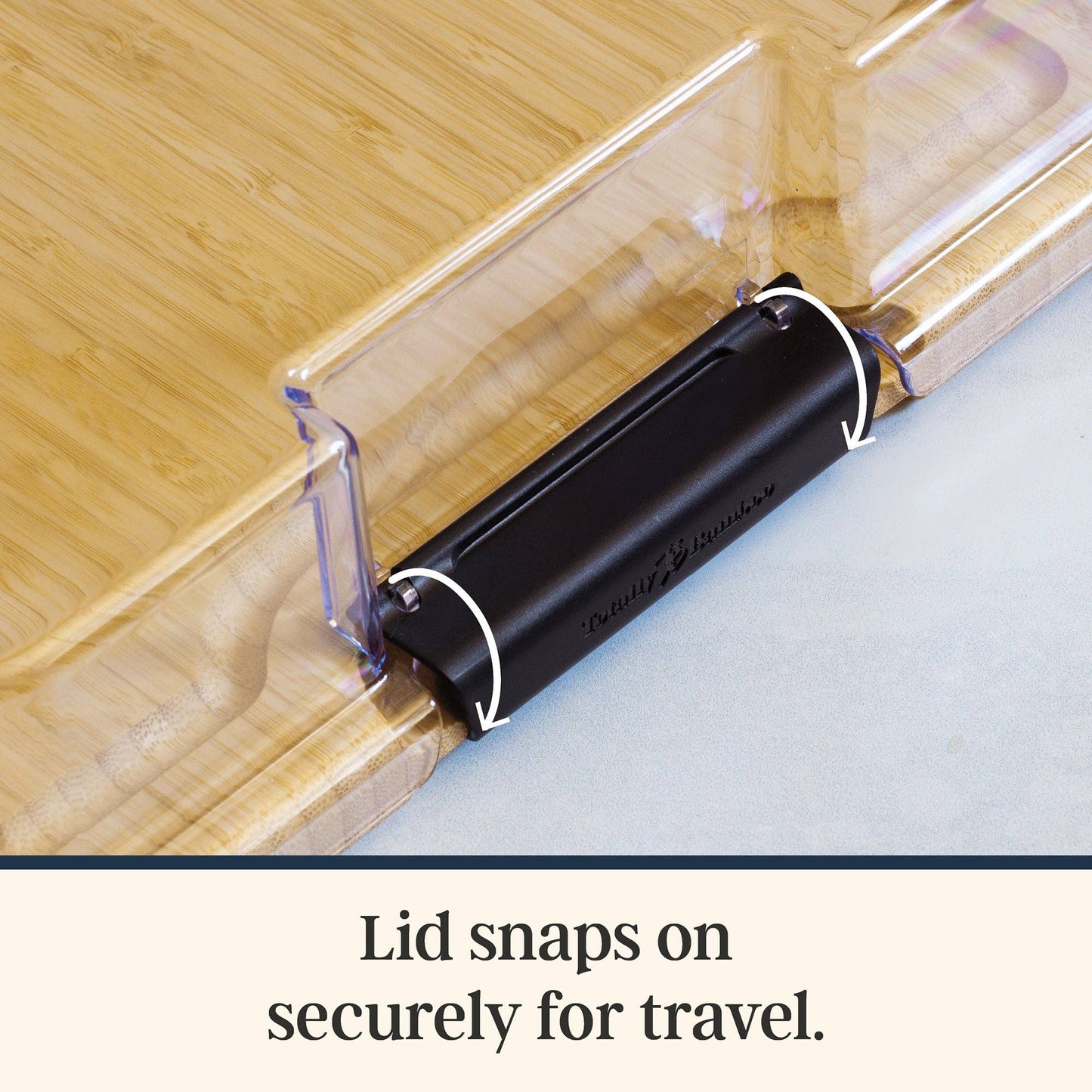 The lid snaps securely for easy travel with this charcuterie board. 