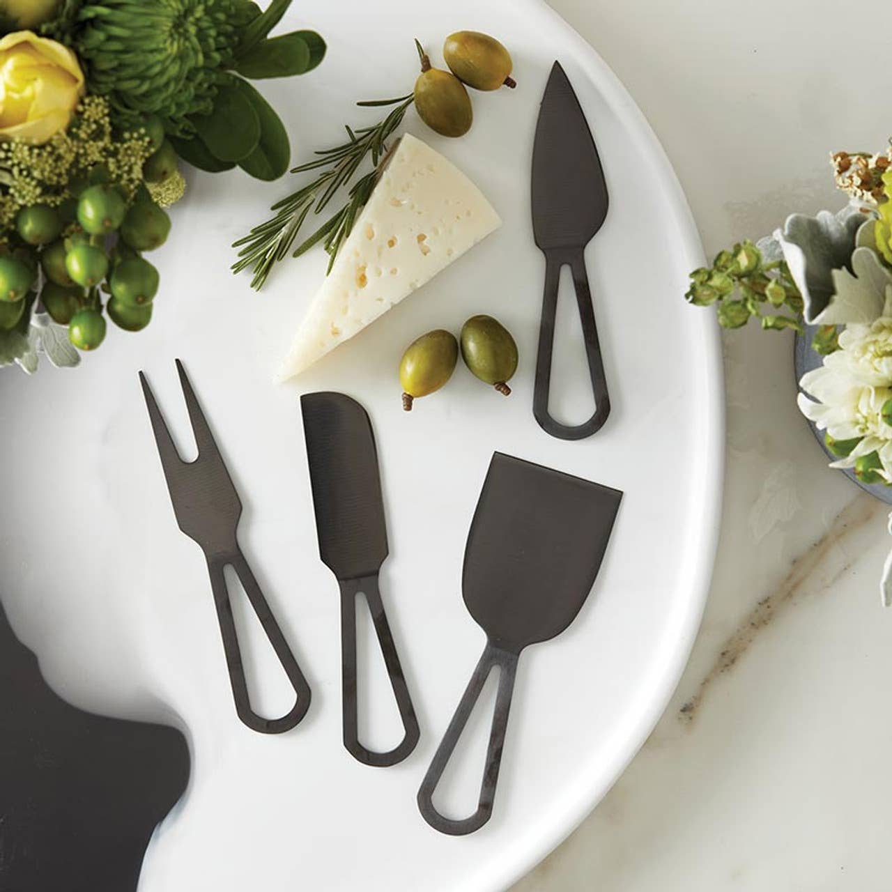 These matte black cheese knives dress up any meet and cheese platter. 