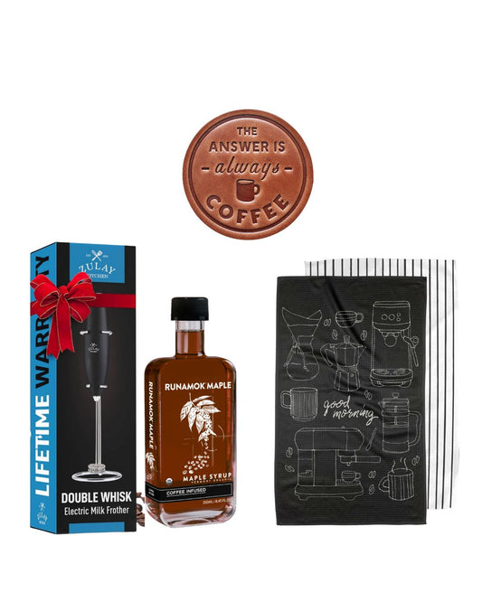 Buy this five-piece coffee lover's gift set, which includes a double whisk milk frother, coffee-infused maple syrup, two barista-inspired kitchen towels, and a leather coffee coaster. 