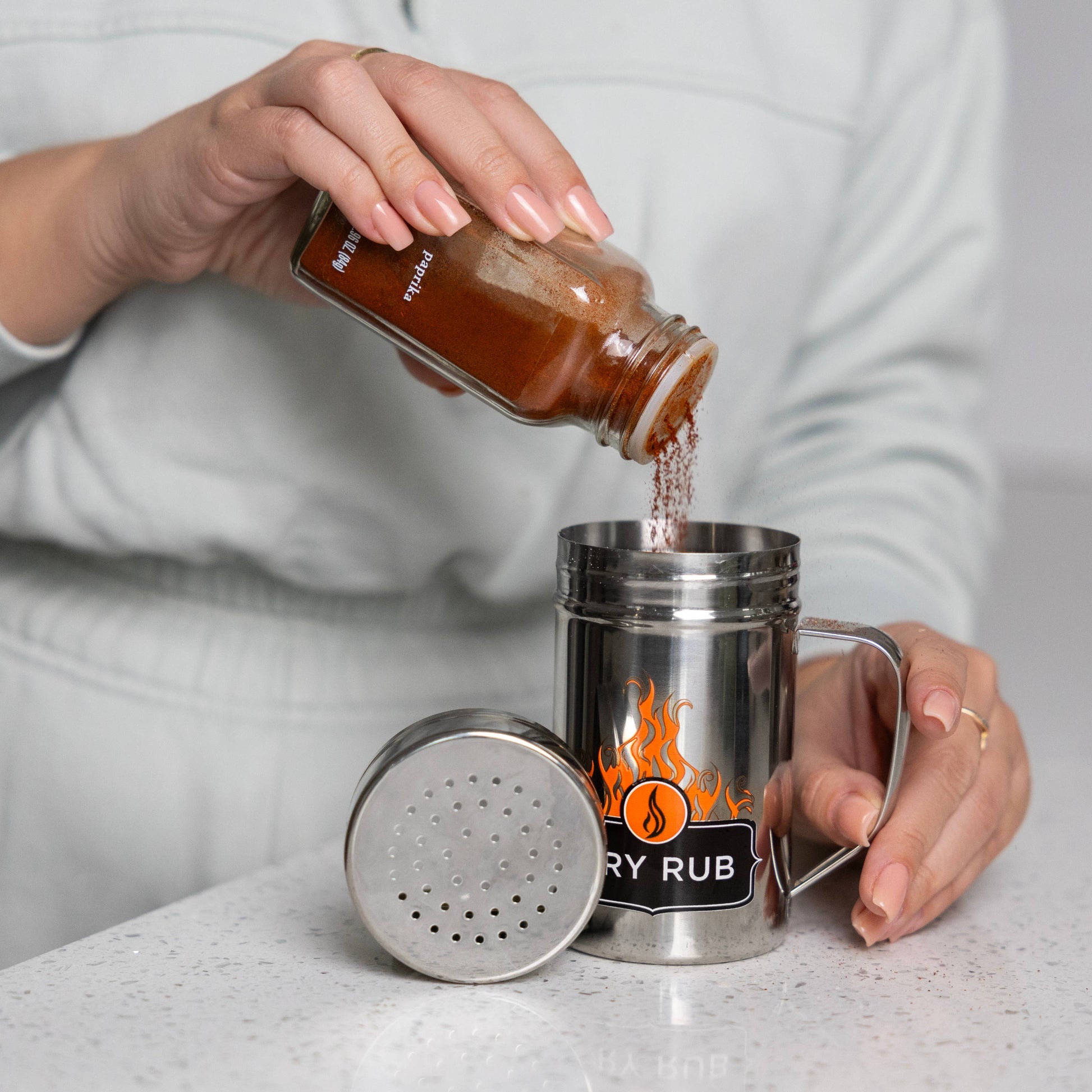 Fill the dry rub shaker with your own blend, or with store-bought variety. It holds more product and applies it more evenly. 