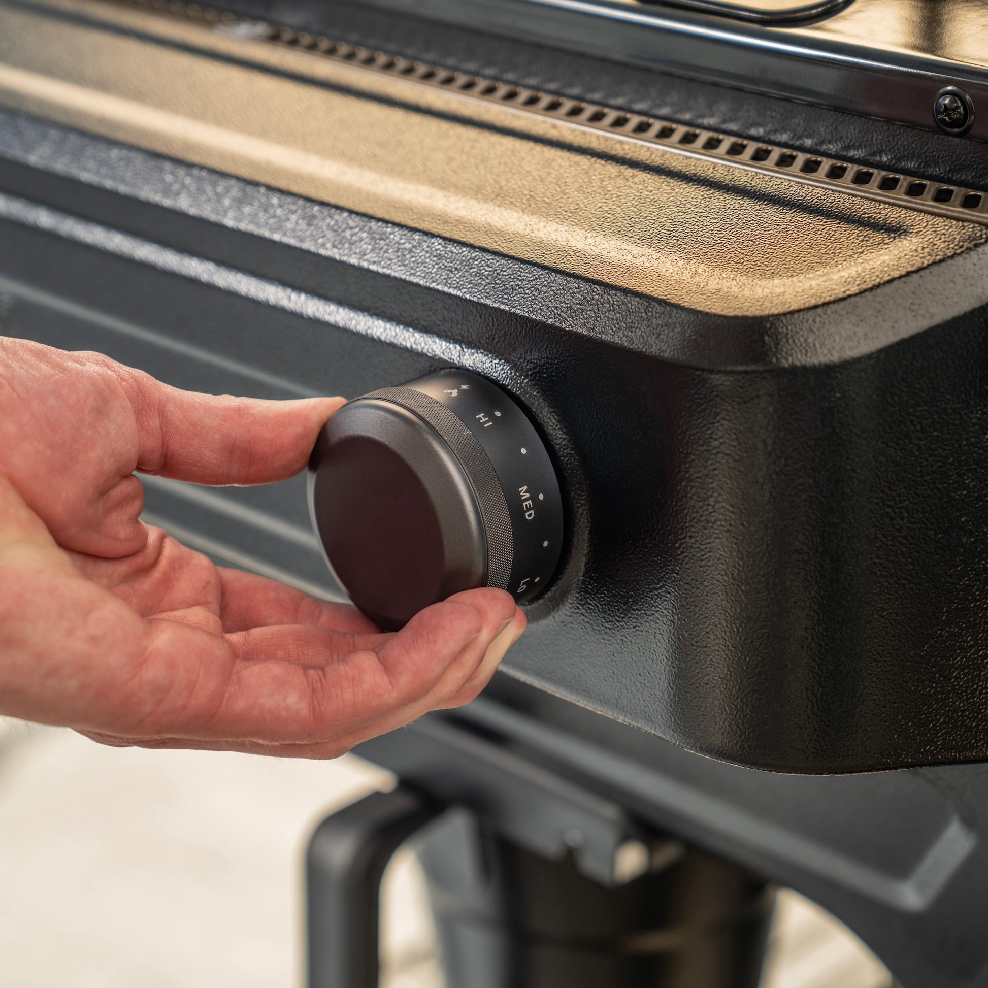 The Trager Flatrock 2-zone griddle is easy to light and is propane-fueled. 