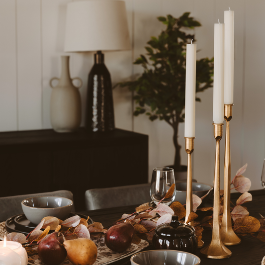 These gold candle holders can be used to style your dining table. 