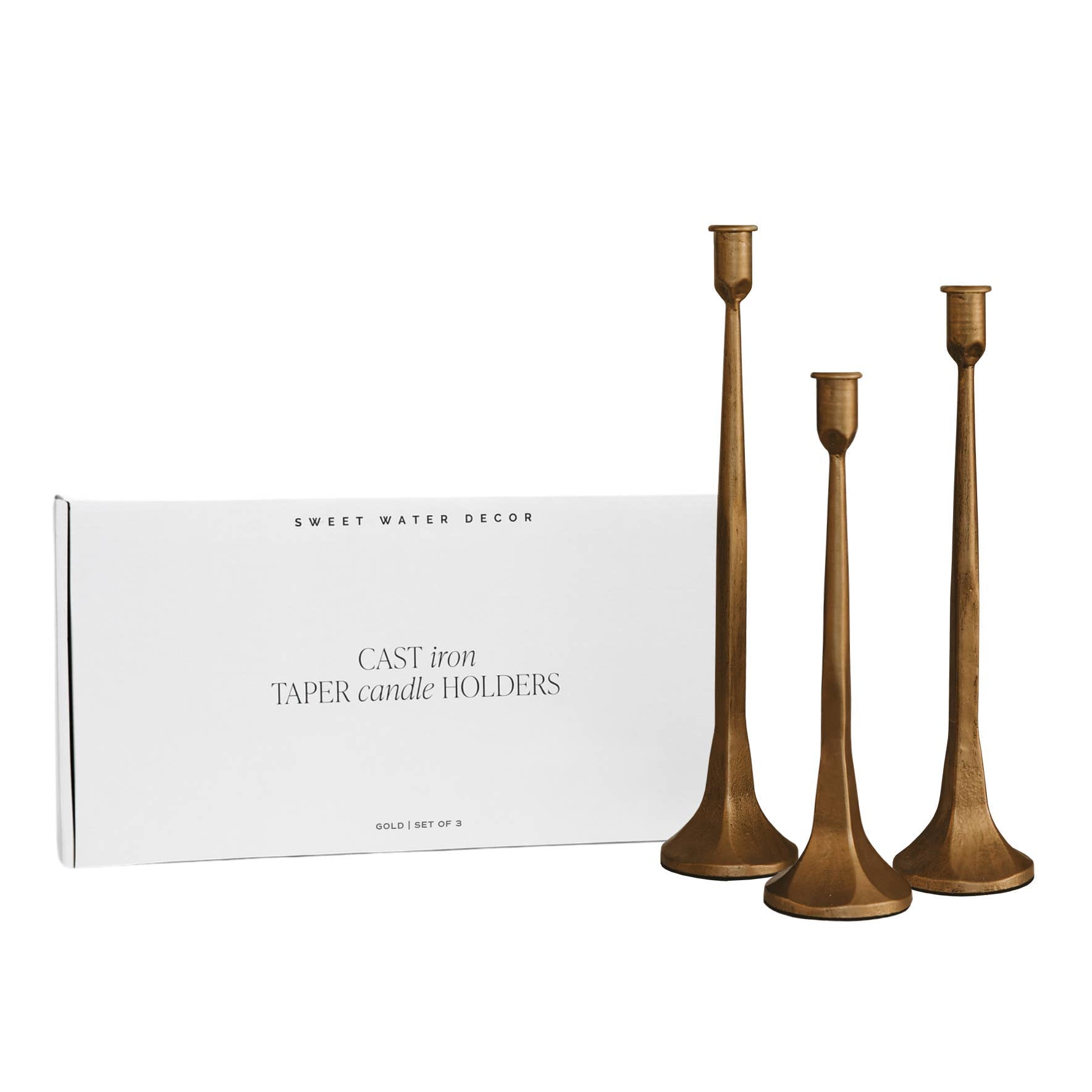 Buy this set of three gold cast iron taper candle holders, which come in a sleek, modern box for gift-giving. 