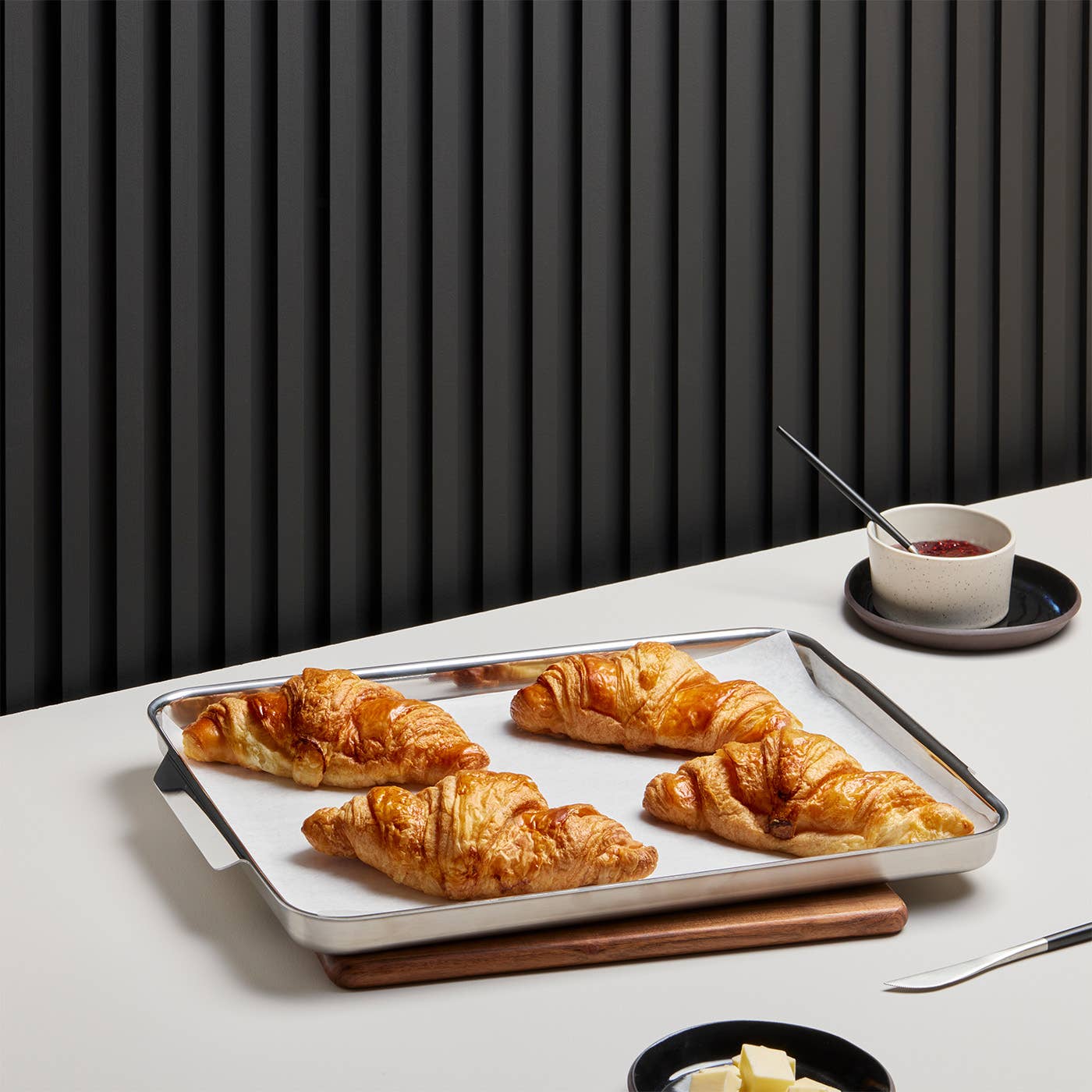 Serve an elegant breakfast like these four fluffy croissants on your new Kana half sheet pan. 