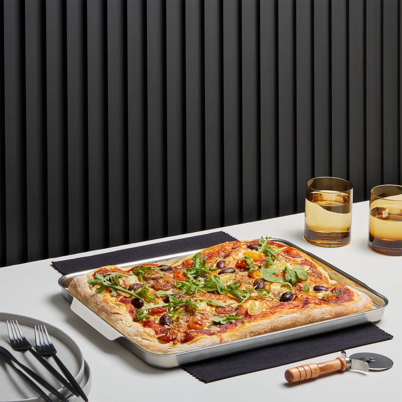Washing this half sheet pan after baking pizza will be easy because the heavy duty stainless steel is dishwasher safe. 