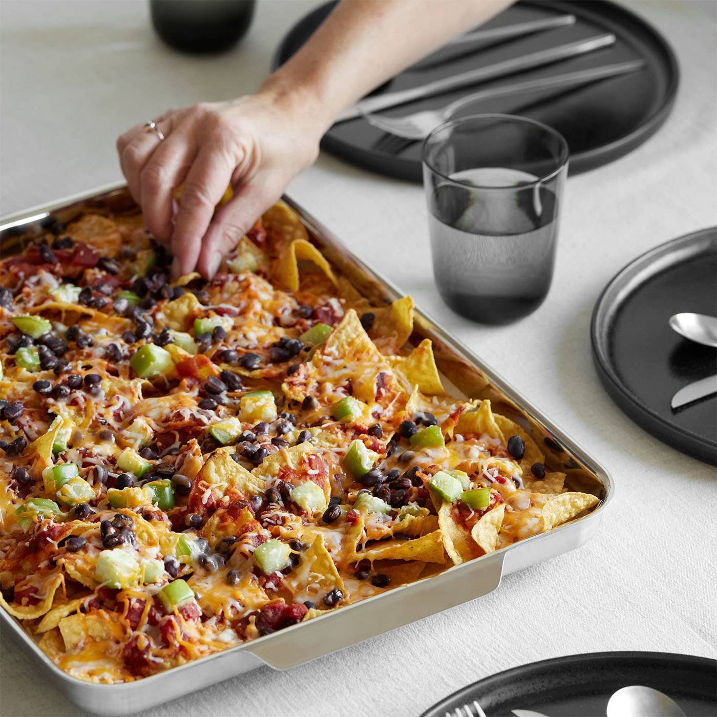 Messy nachos are no match for this stainless steel pan, which is dishwasher friendly!