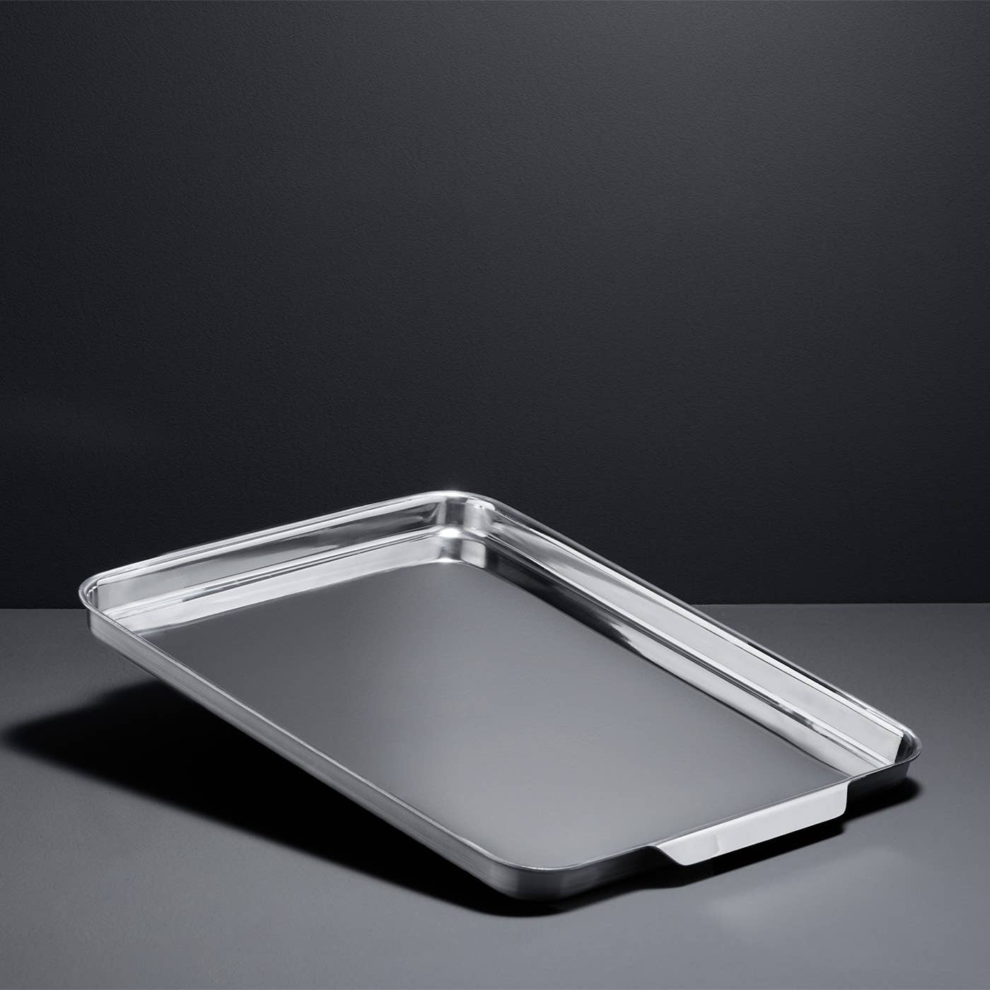 The stainless steel half sheet pan comes with large, ergonomic handles. 
