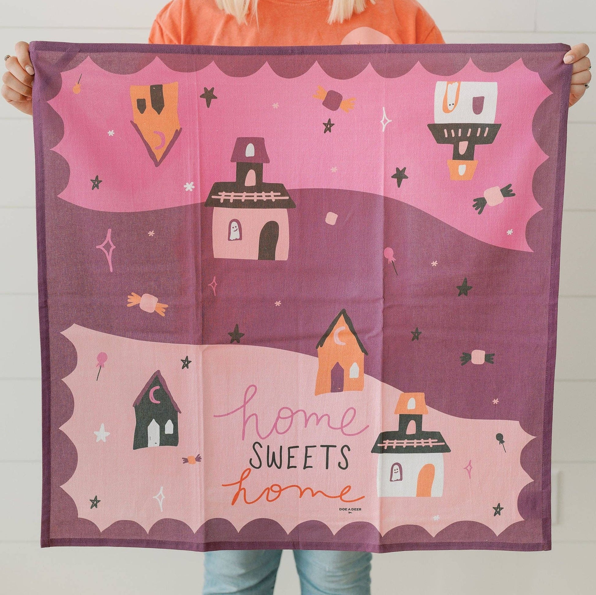 Buy a purple and pink Halloween tea towel for a scary-sweet look.