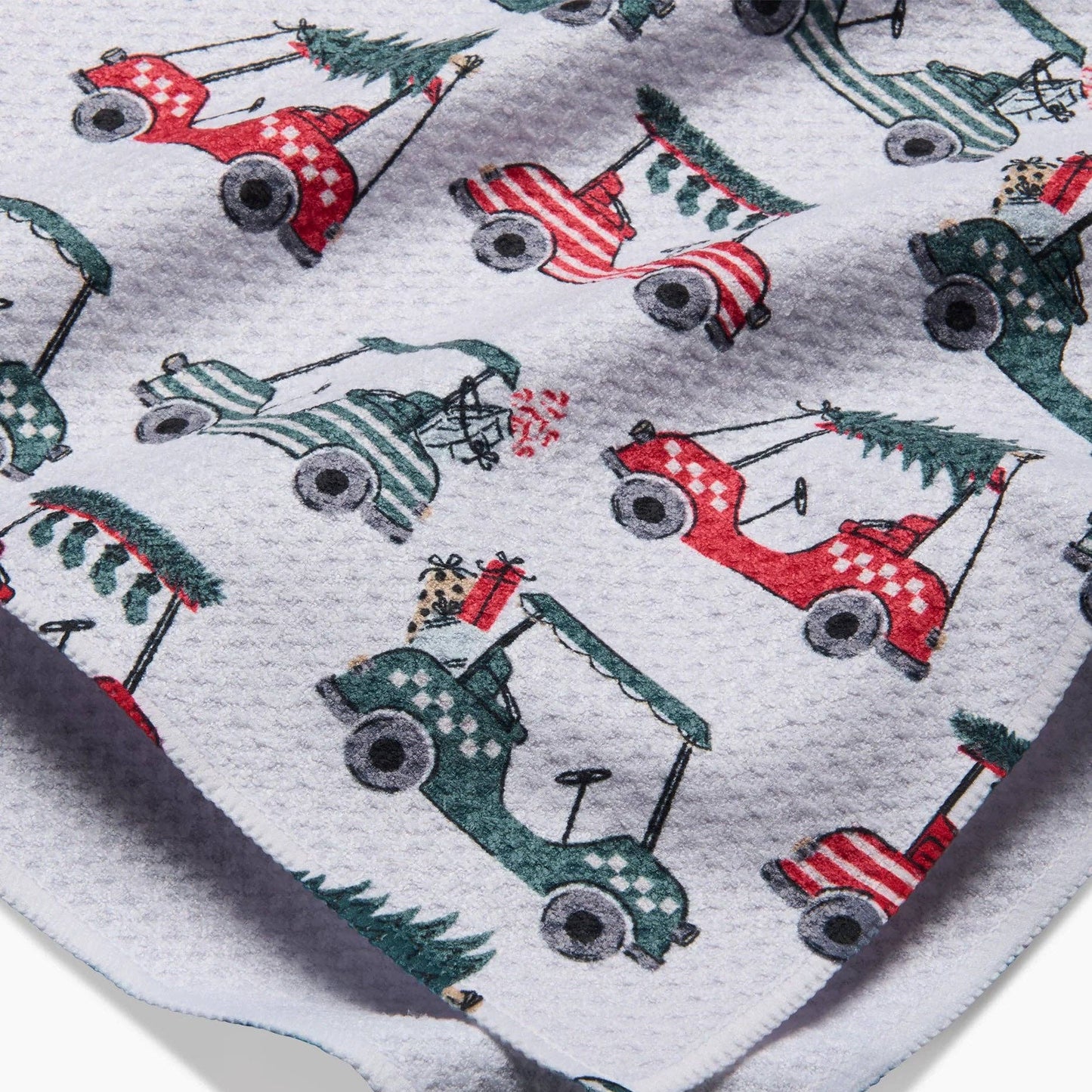 This holiday tea towel is a great gift for golfers. 