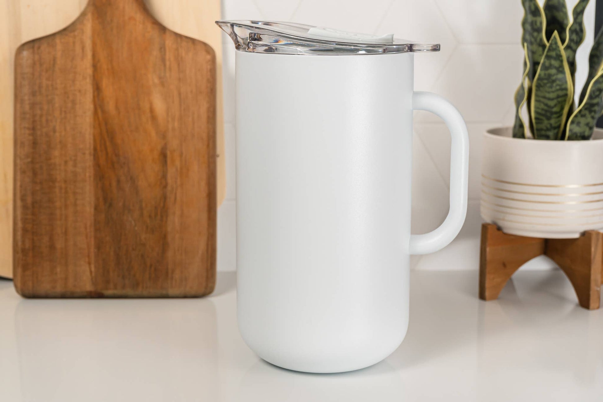 An insulated pitcher will blend into your home decor seamlessly - buy 1 (one) in white.