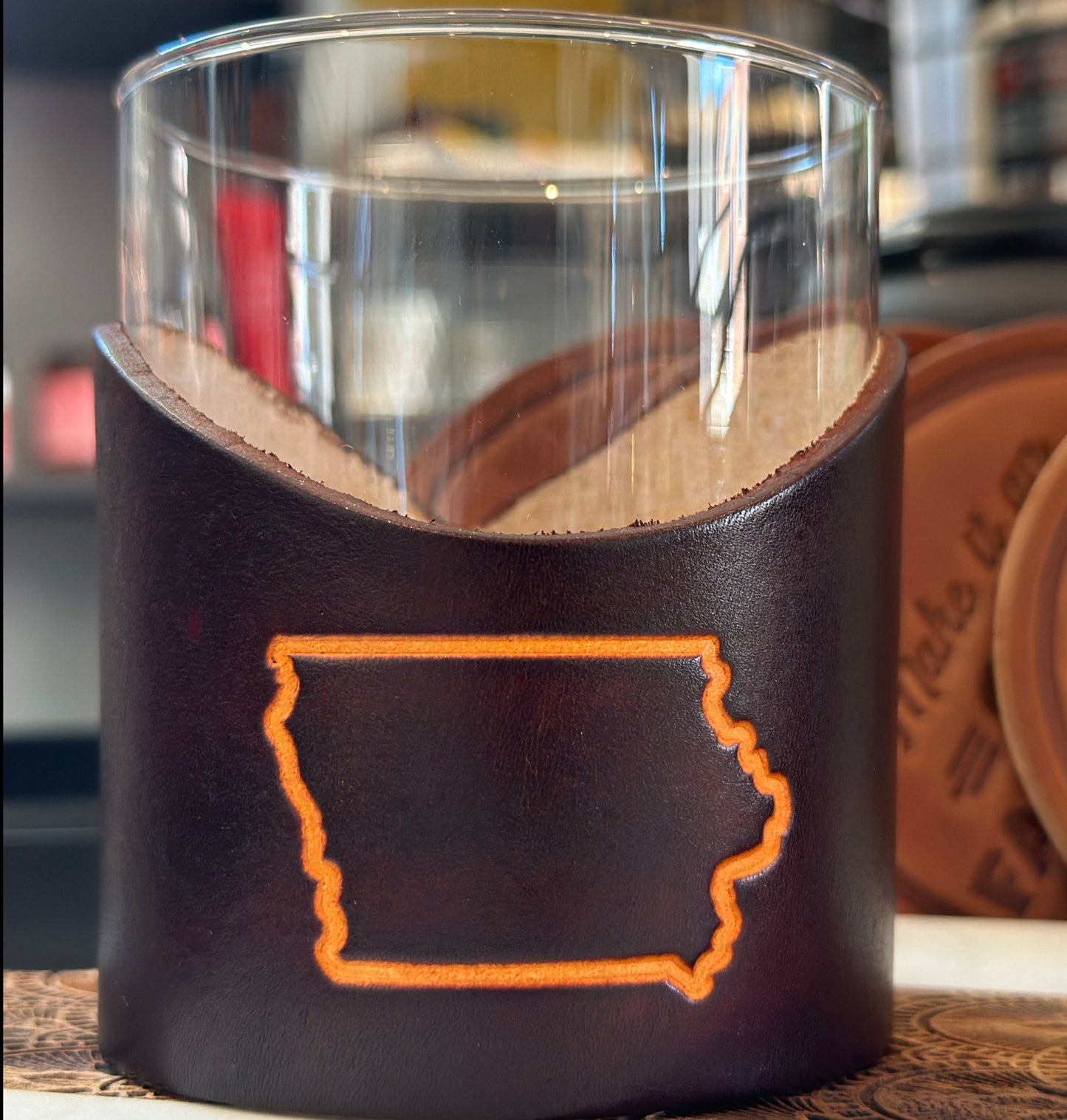Buy one (1) rocks glass wrapped in leather with an imprint of the state of Iowa.