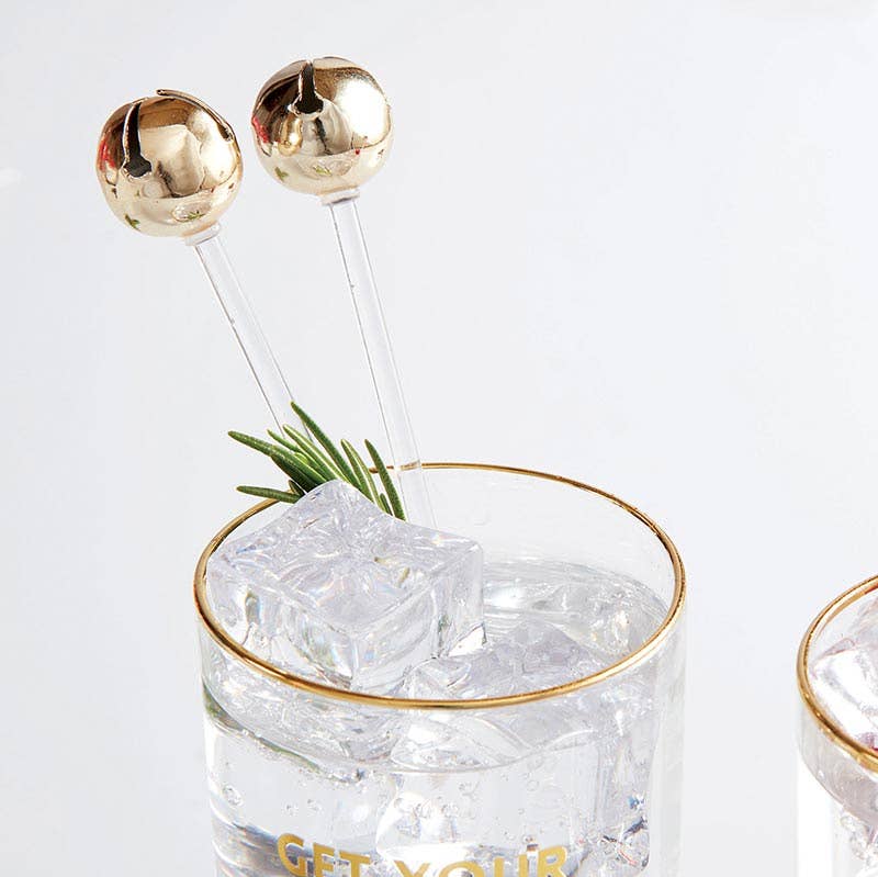 Bring a festive, playful twist to your signature holiday cocktails when you buy these jingle bell stir sticks. 